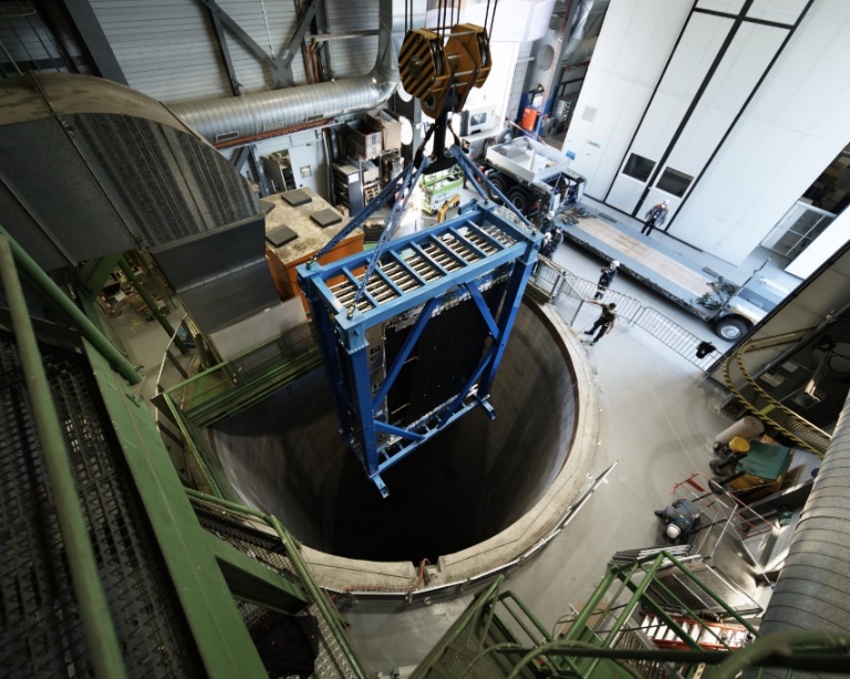 Lowering the first four of the 12 pieces that make up the SciFi detector 100 metres underground. 